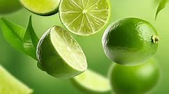 juicy limes are flying in organic background
