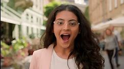 Young surprised amazed excited woman Indian Arabian female girl outside. Positive businesswoman shock smiling open mouth town street win gesture sincere happy delight emotion astonishment announcement