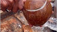 Hardworking Super Tallented Man Peeling Raw Coconut