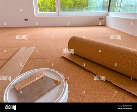 Cork panels are glued to the floor to insulate against footfall noise ...