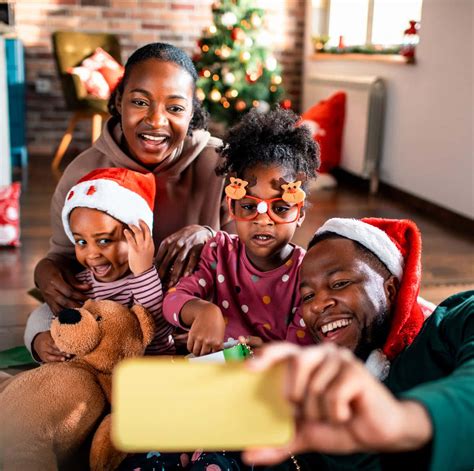 Download Joyful Black Family Celebrating Christmas | Wallpapers.com