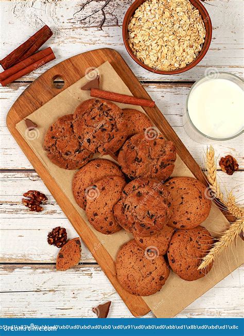 Homemade Chocolate Chip and Nut Gluten Free Oatmeal Cookies with Ears on Wooden Background ...