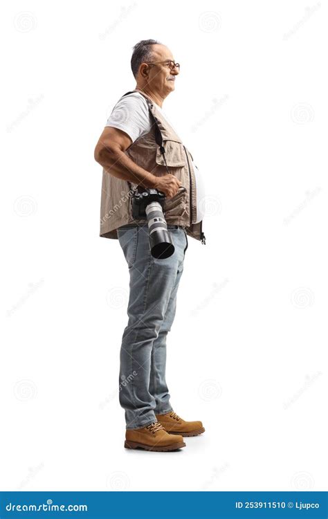 Full Length Profile Shot of a Mature Male Photographer Carrying a Camera Stock Photo - Image of ...