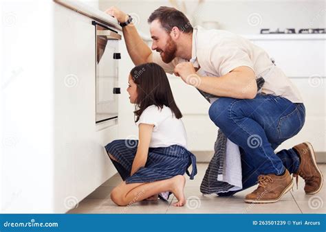 Father Waiting with Child by the Oven. Dad and Little Daughter Baking ...