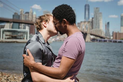 Two Men Kissing Outside · Free Stock Photo