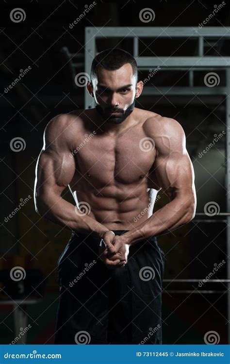Handsome Body Builder Making Most Muscular Pose Stock Image - Image of ...