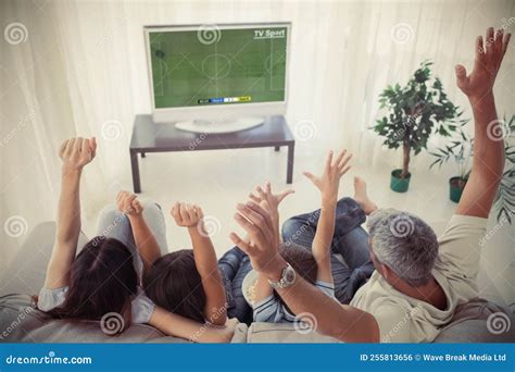 Caucasian Family Sitting on the Couch and Watching Football Match Stock ...