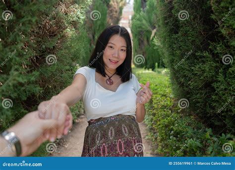Young Happy and Beautiful Asian Japanese Woman Posing Outdoors Happy and Cheerful in the City ...