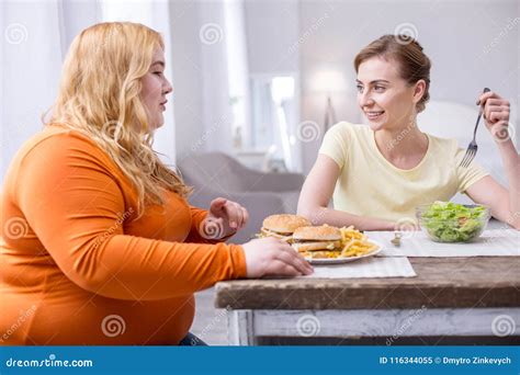Alert Fat Woman Having Lunch with Her Friend Stock Image - Image of ...