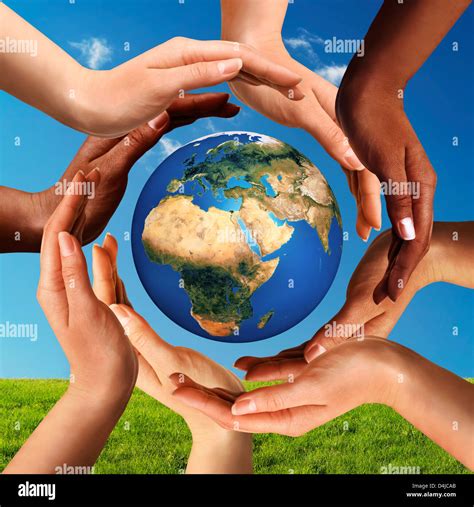 Hands around globe hi-res stock photography and images - Alamy