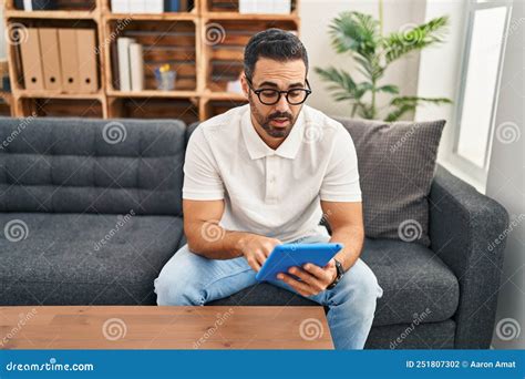 Young Hispanic Man Psychologist Having Therapy Session Using Touchpad ...
