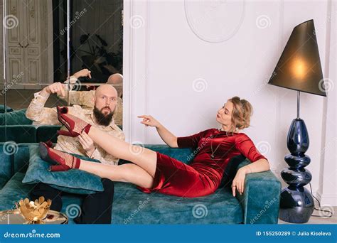 A Handsome Man Kissing a Woman`s Foot in Red Shoes Stock Image - Image ...