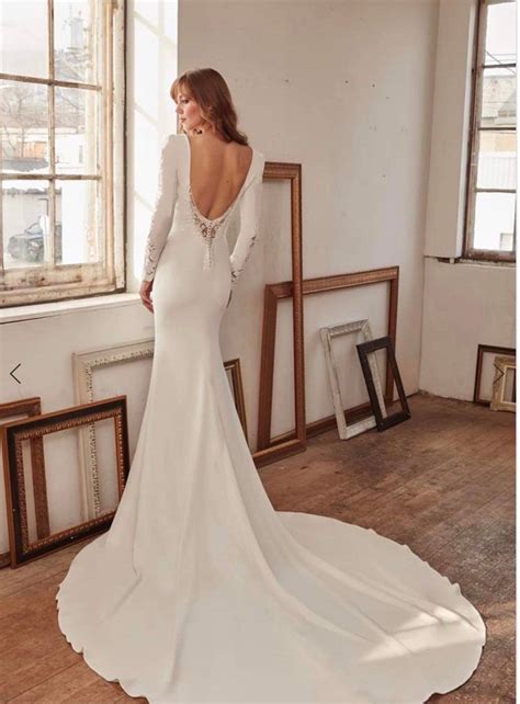 Long Sleeve Wedding Dress With Lace Details, Low Back Train Fit and Flare Silhouette. Bridal ...