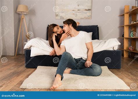 Sensual Woman Seducing Young Man in Stock Photo - Image of brunette ...