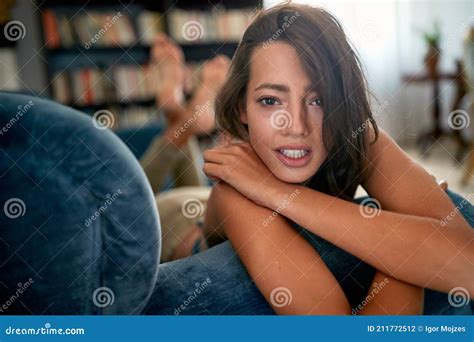 A Young Beautiful Girl Posing and Teasing on the Sofa. Relaxation, Home ...