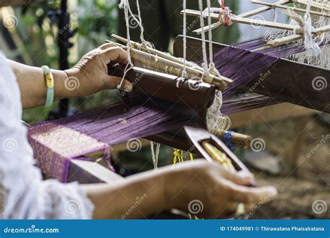 Traditional Isan Thai Silk Weaving. Old Woman Hand Weaving Silk in ...