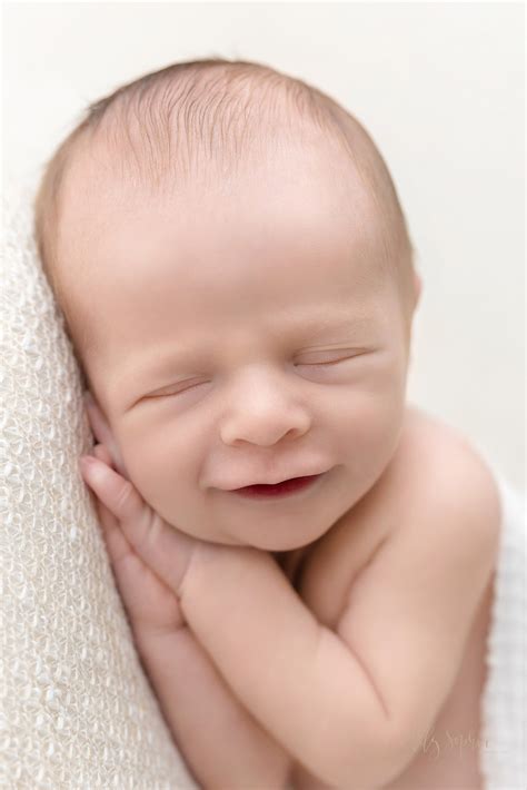 Sleeping Newborn Baby Smiling