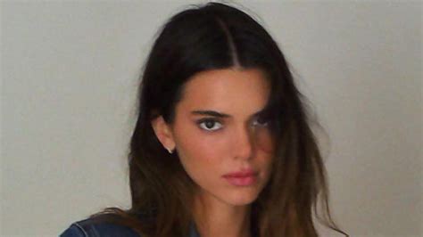 Kendall Jenner has near wardrobe malfunction as she pulls down her teeny bikini bottoms in new ...