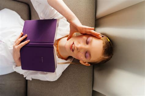 Girl Reading while Lying Down · Free Stock Photo