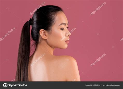 Sexy naked chinese woman posing on purple studio background — Stock ...