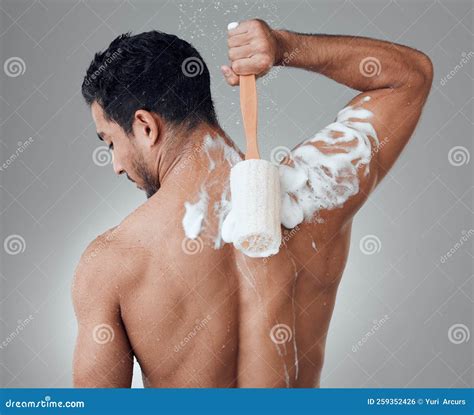 Ive Got My Own Back. a Young Man Taking a Shower Against a Grey ...