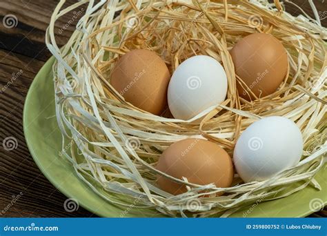 Brown and White Eggs in a Straw Nest Stock Photo - Image of breakfast ...