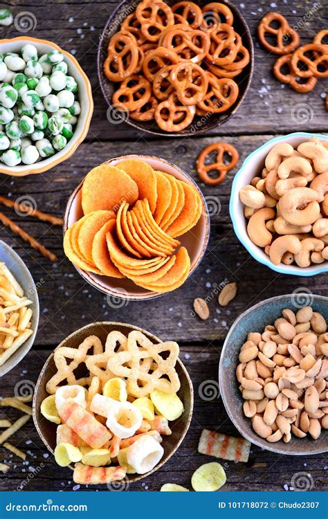 Different Kinds of Snacks - Chips, Salted Peanuts, Cashews, Peas with ...