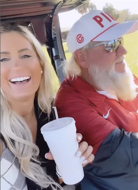 Justin Thomas signs chest of OnlyFans model Karin Hart