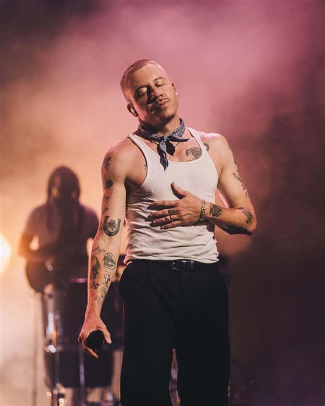 Download Macklemore Performingon Stage Wallpaper | Wallpapers.com