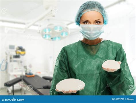 Surgeon Woman Holding Silicon Breast Implants Stock Image - Image of choose, medic: 39359729