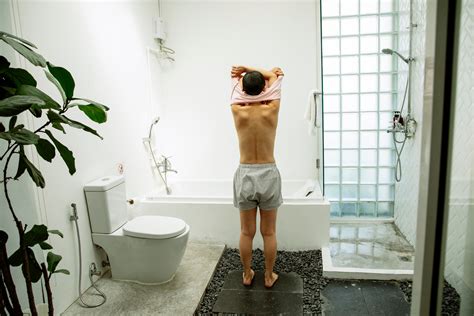 Faceless woman undressing in bathroom near toilet and shower - Photos ...