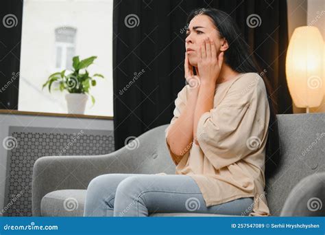 Woman with Severe Toothache Touching Her Swollen Cheek. Young Girl Feeling Discomfort after ...