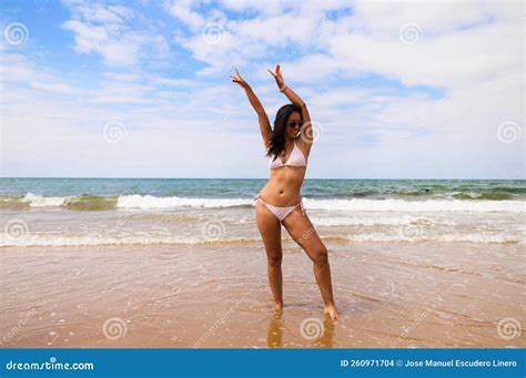 Beautiful Young Woman Posing and Doing Different Poses and Raising Her ...