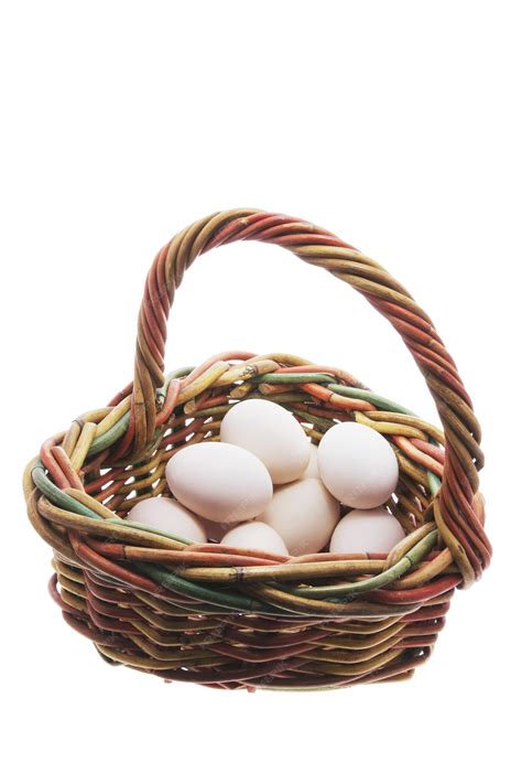White eggs in basket | Premium Photo