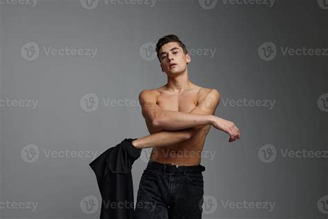 Handsome male nude black shirt isolated background posing 22309952 Stock Photo at Vecteezy