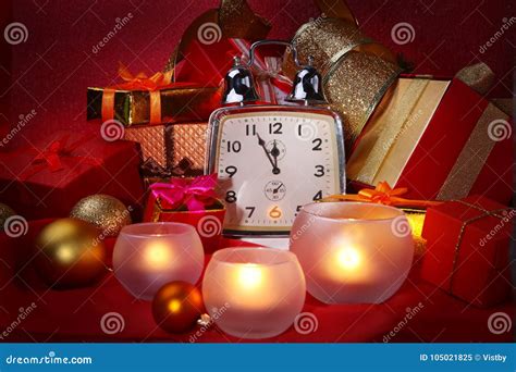 Christmas Clock and Candles. New Year`s Decoration with Gift Boxes ...