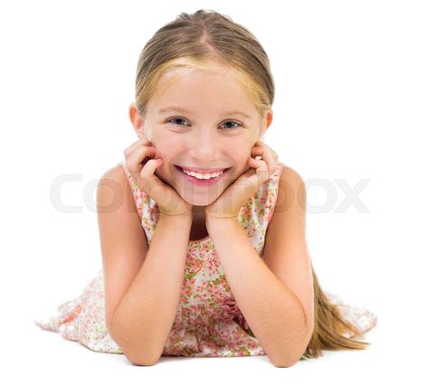 smiling little girl lying on the floor | Stock image | Colourbox