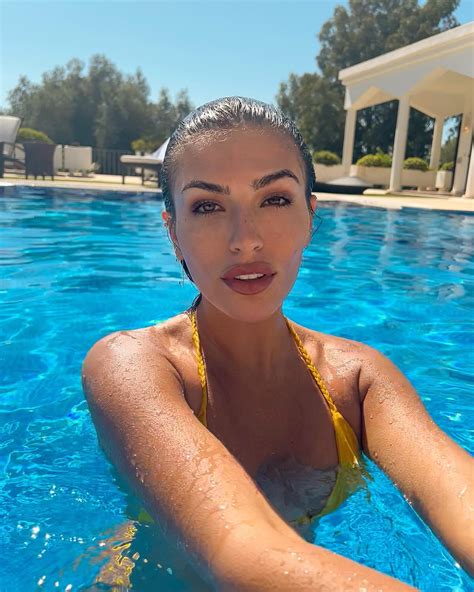 Emily Faye Miller Snaps A Selfie In A Yellow Thong Bikini