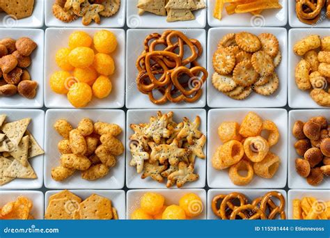 Background of Many Types of Savory Snacks in White Square Dishes Stock ...