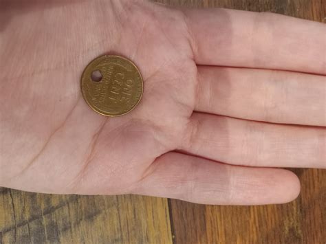 I found a penny with a tiny hole in it : r/mildlyinteresting