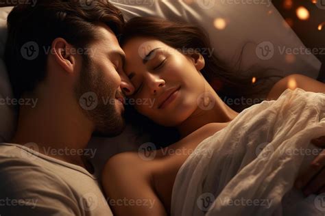 happy couple sleeping on a bed in romantic mood with 25664196 Stock ...