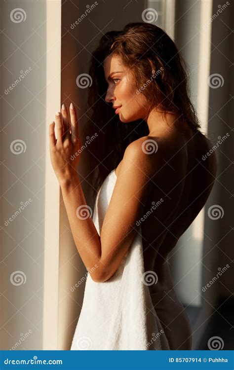 Young Woman with Naked Back Standing by Window Stock Photo - Image of ...