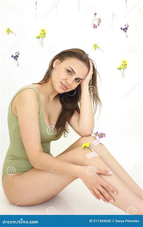 Crop Woman with Flowers on Knees Stock Image - Image of detail ...