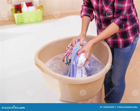 Woman Washing Clothes By Hand