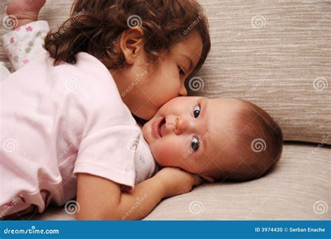 Sisters kiss stock photo. Image of sister, familial, family - 3974430