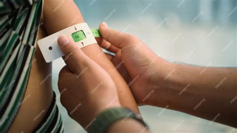 Premium Photo | Measuring malnutrition using strap muac mid-upper-arm ...