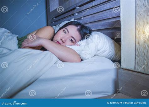 Young Beautiful Depressed and Sad Asian Chinese Woman Having Insomnia ...