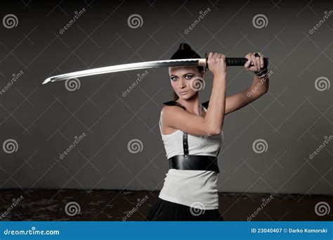 Woman Wielding Ceremonial Sword Stock Image - Image of confident, grey ...