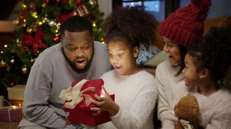Download Black Family Christmas Gift Opening Picture | Wallpapers.com