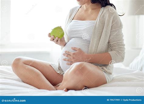 Close Up of Pregnant Woman Eating Apple at Home Stock Image - Image of happy, expectation: 79577991